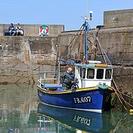 Fisherman on fishing boat in the Pennan harbor, a small coastal village in Aberdeenshire, Scotland, UK
<BR><BR>More images at www.arterra.be</P>